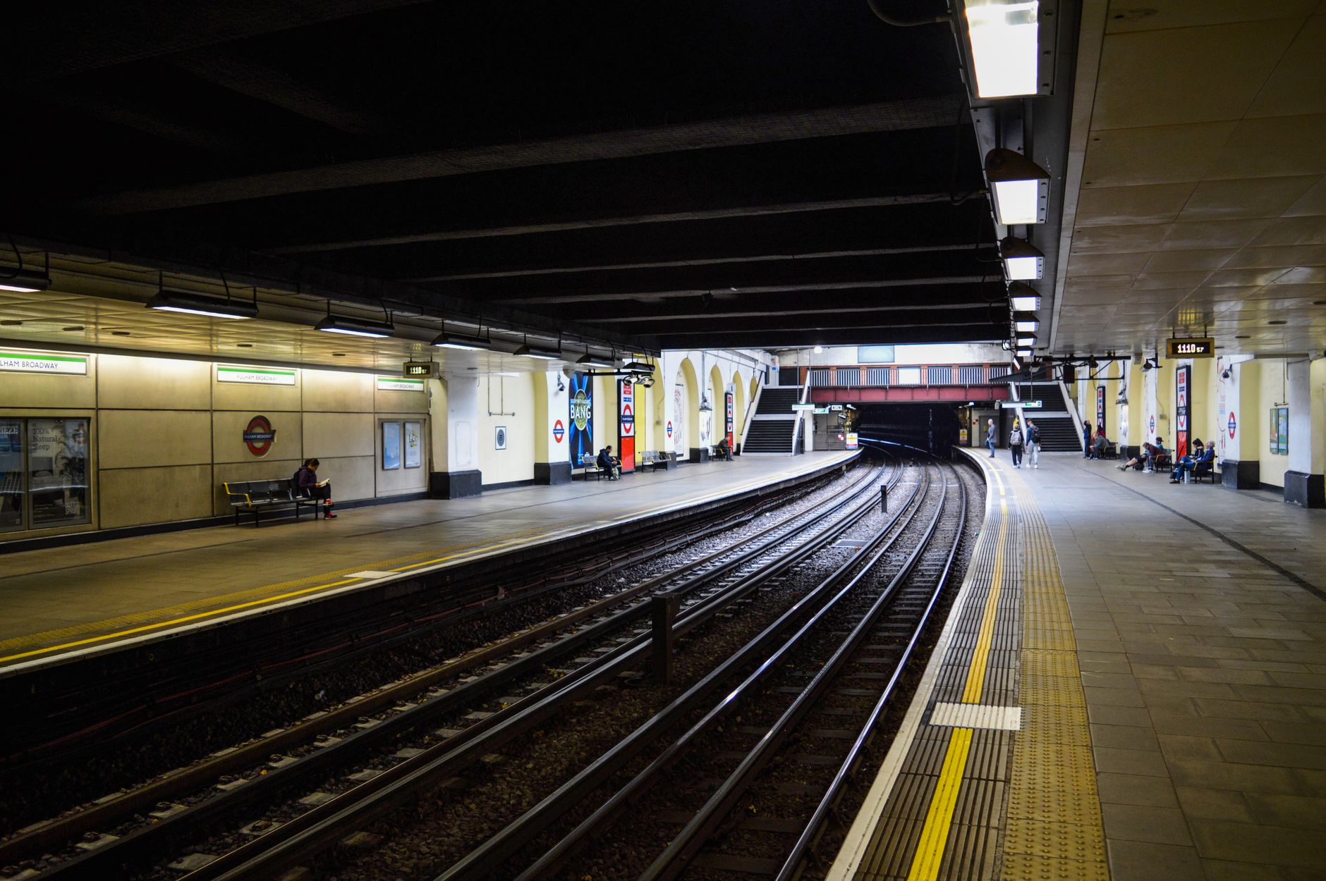 Commuters on an English train station platform during Great British Railways nationalisation transition
