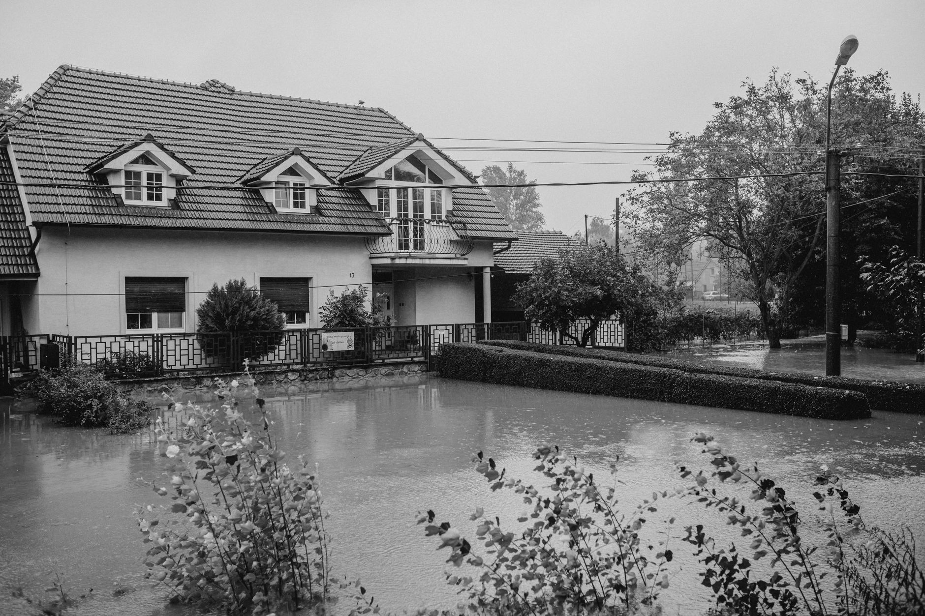 Flooded residential street illustrating the UK flood insurance uninsurable homes crisis in 2026