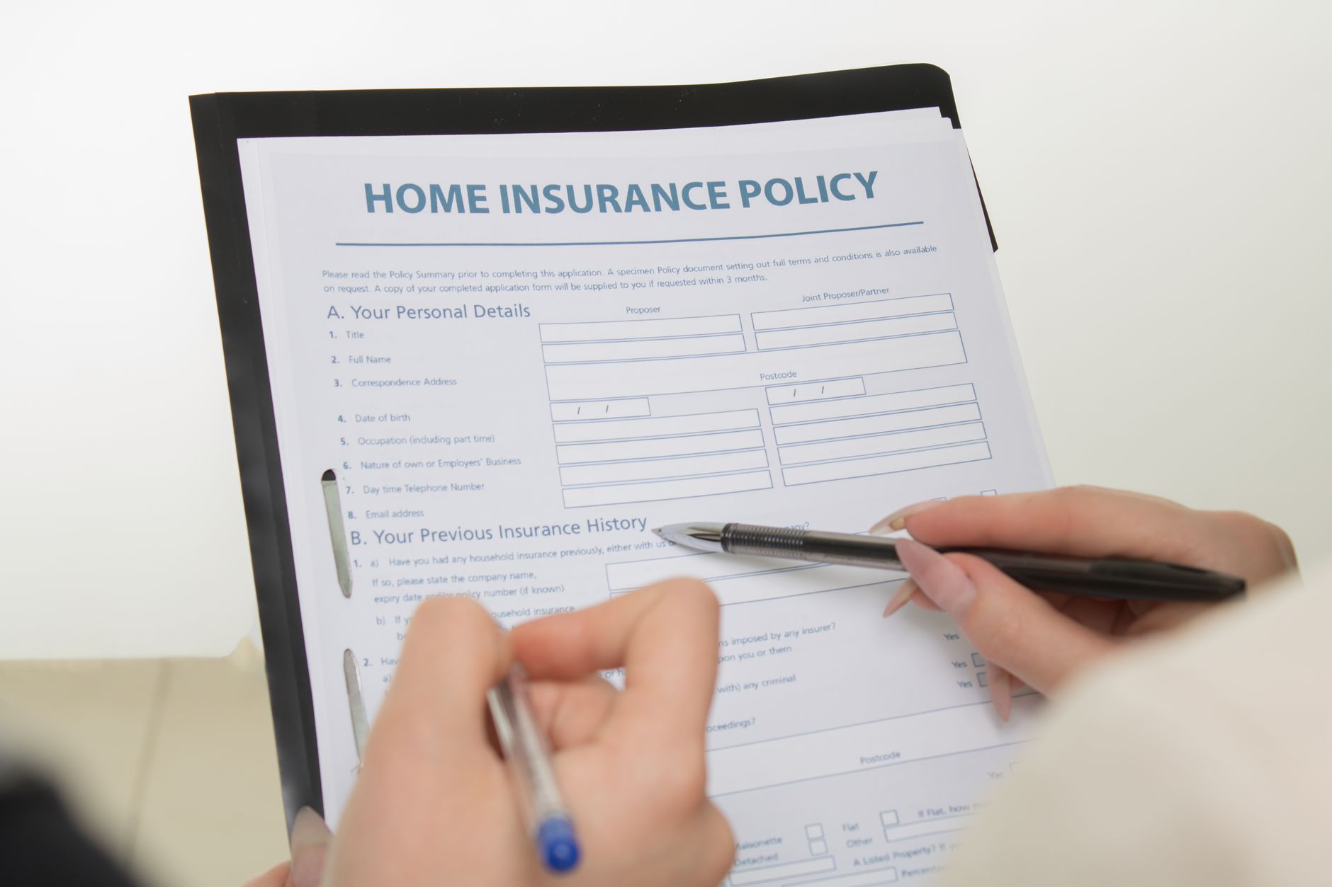 Home insurance documents highlighting the challenge of UK flood insurance for uninsurable homes in 2026