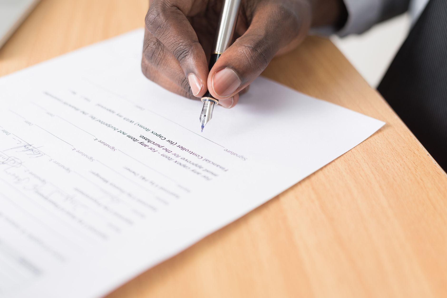 Tenant reading a rental agreement, reflecting challenges in the private rental sector UK